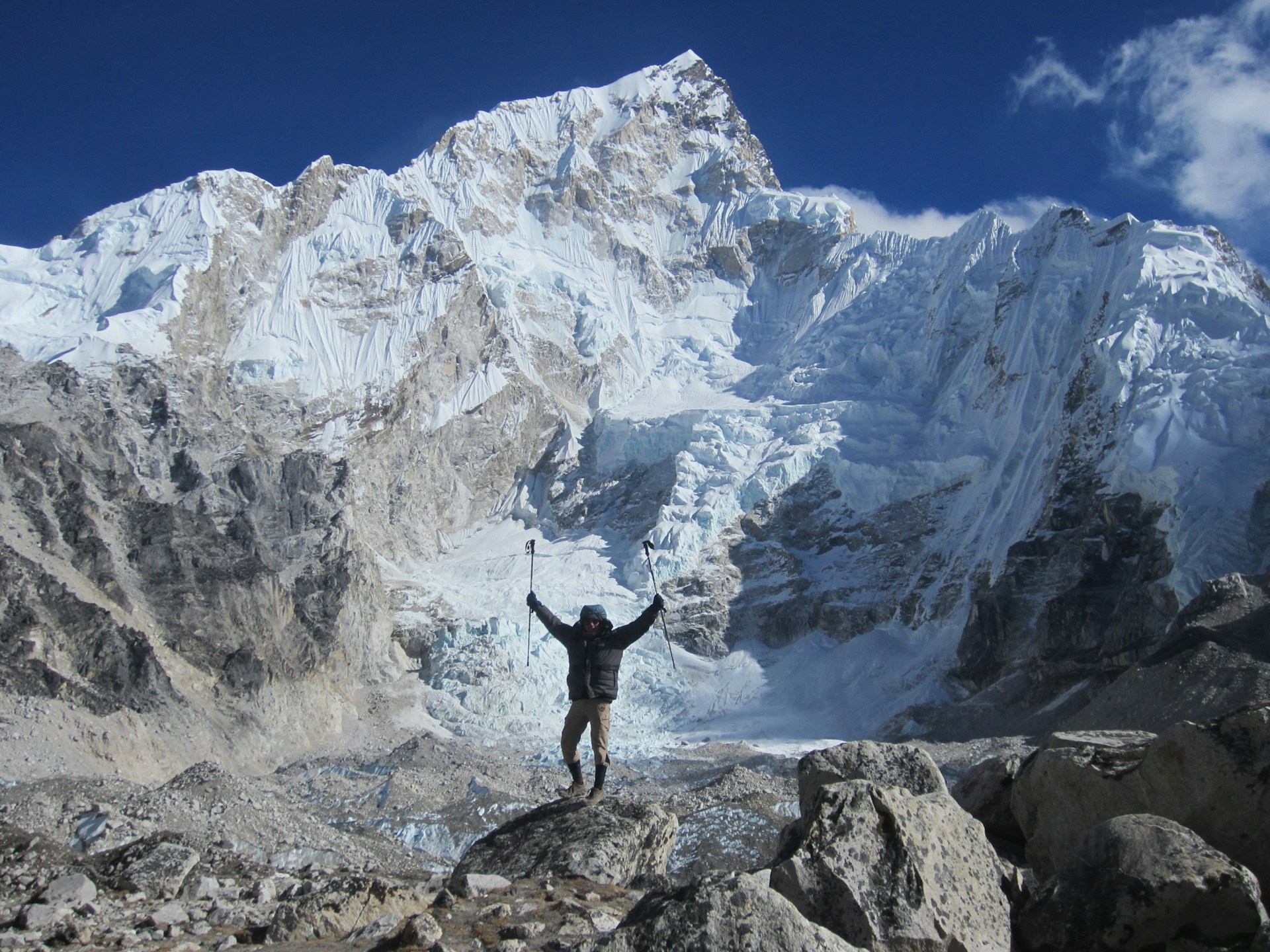 a person standing in front of Mount Everest